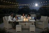 Family sitting around a fire pit table with string lights and a full moon in the background