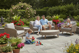 Outdoor furniture set with sofa, chairs, and ottoman on a white background