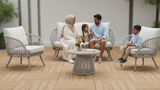Outdoor furniture set with white cushions on a wooden deck