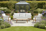 Outdoor furniture set with a sofa, two chairs, and a coffee table on a white background